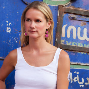 Hot Pink Embroidered Double Drop Earrings Styled On Maggie in White Tank Top with Blue Background